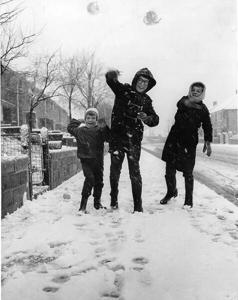 Three youngsters at Llanrumney, Cardiff throw snowballs at the cameraman during