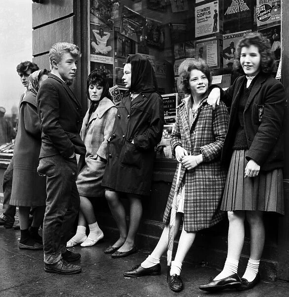 Youngsters stand outside a record shop hoping to listen to free spins near Smithfield