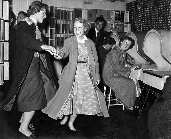 Youth Culture: Two girls dance whilst listening to the latest recordings at their local