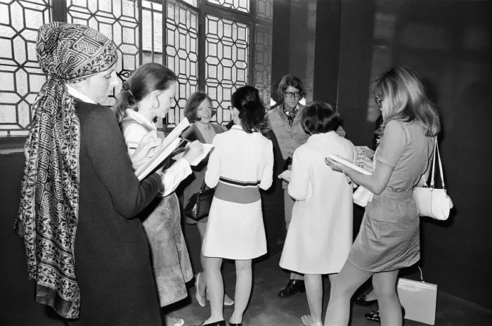 Framed Print : Yves Saint Laurent, designer, pictured speaking with journalists at the opening of his