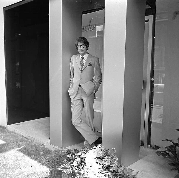 Yves St. Laurent pictured outside his new boutique in the Rue de Tournon on the left bank