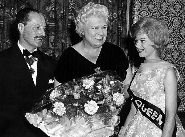 Yvonne Partridge. the Coventry Hairdressing Queen, presenting a bouquet to Alderman Mrs