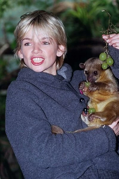 Zoe Ball Radio  /  TV Presenter October 1998 At London Zoo holding a baby bear she has