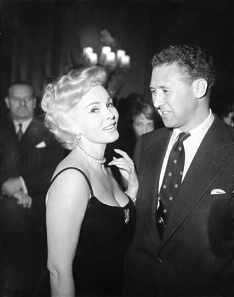 Zsa Zsa Gabor and Anthony Quayle at a reception at The Dorchester Hotel, London
