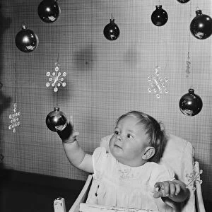 10 month old vavy boy Christopher Trayhorn of Stevenage New Town playing with hanging