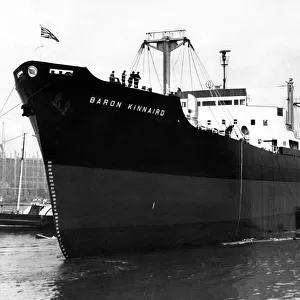The 11, 800-ton cargo ship Baron Kinnaird slides down the slipway at the shipyard of