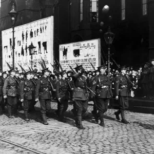 The 16th Manchesters march past Lord Kitchener at Manchester Town Hall with the rest of