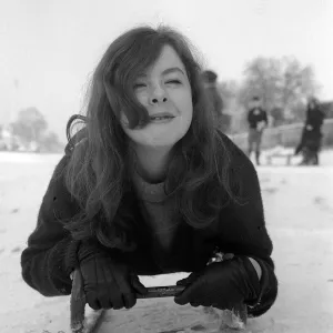 17 year old Jenny Kane of Hadley Wood rests on her sledge after Tobogganing on Hampstead