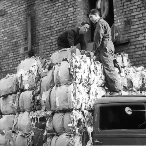 1941, A lorry is loaded with 50 bales of salvage paper weighing three tons at Newcastle 1941, A lorry is loaded with 50 bales of salvage paper weighing three tons at Newcastle