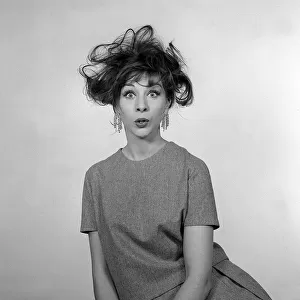 1960s Fashion Hair Styles December 1960 Woman pulling a bemused / shocked facial