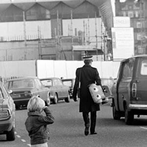 1975 Brighton Toy Fair. Small boy cries as Traffic Warden confiscate toy pedal car for