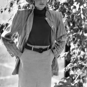 1980s Womens Fashion: Our model wears a waist high belted skirt a stripe jacket over 1980s Womens Fashion: Our model wears a waist high belted skirt a stripe jacket over