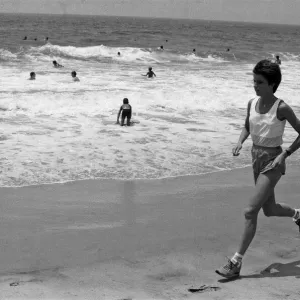 The 1984 Summer Olympics in Los Angeles. Wendy Sly running on Manhattan Beach, California The 1984 Summer Olympics in Los Angeles. Wendy Sly running on Manhattan Beach, California