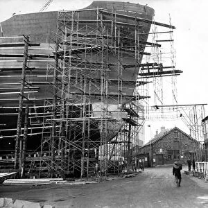 The 21, 000-ton ship Demerterton towers above the offices at the shipyard of John Redhead