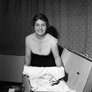 21-year-old actress Anne Reid at home in Kensington packing her bags before leaving for