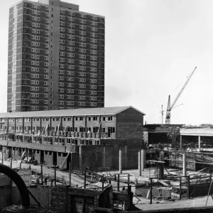 A 22-storey block - shops at ground level and flats above - dominates the scene of more