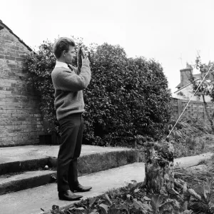 23 year old Gordon Faulkner in his garden, holding the camera with which he photographed 23 year old Gordon Faulkner in his garden, holding the camera with which he photographed
