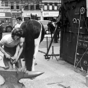 23 year old Londoner Derek Dewdney the village blacksmith of Brent, London