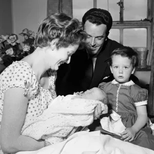 3-year-old Louisa, daughter of Brian Rix and Elspet Gray, meets her new baby brother