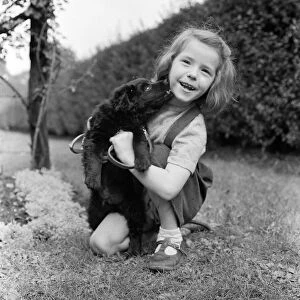 6 year old Ann Field and her dog. Ardwick, Manchester, 7th March 1957