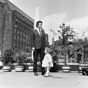 6ft 3 Clint Eastwood, pictured in St Peters Square, Manchester, with Antony Rixon