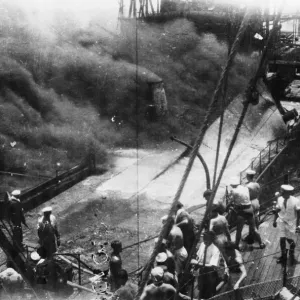 Print of the HMS Lavender alongside a blazing tanker in the Caribbean Sea