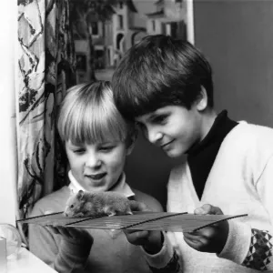 7 years old Mare Swallow, left and his friend Christopher Rock with Sandy