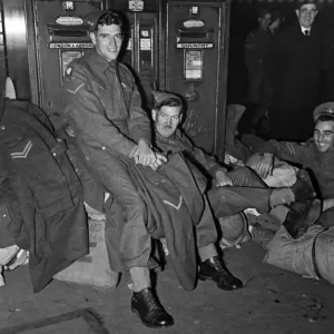 8th Army returning on leave from the Middle East. (left) Corpl. A 8th Army returning on leave from the Middle East. (left) Corpl. A