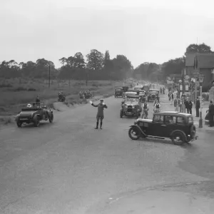 A a patrolman directs August Bank Holiday traffic outside The Orleans Arms situated
