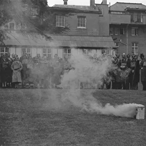 A. R. P. demonstration at Esher. Wardens wearing thir gas masks. April 1938