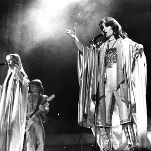 Abba singing on stage in February 1977