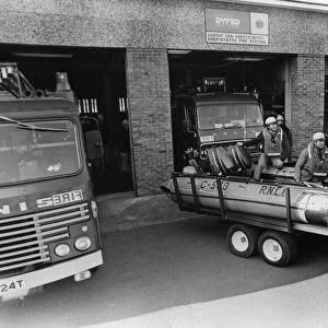 Aberystwyths RNLI crew and their boat at the towns fire station