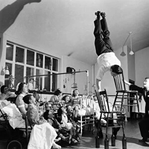 Acrobat Fred Edwards performing at a childrens hospital. May 1953 D2247