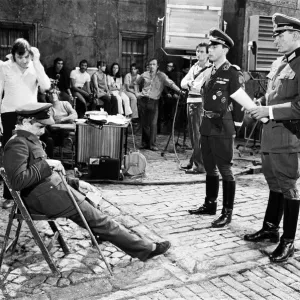Actor David McCallum (seated) on the film set during filming of Colditz Actor David McCallum (seated) on the film set during filming of Colditz