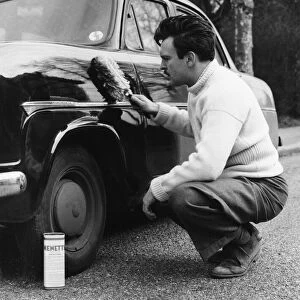 Actor Donald Sinden seen here polishing his Ford Consul. Circa February 1955