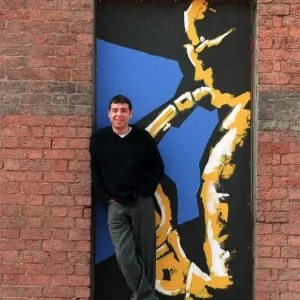 Actor Jake Abrahams in an old theatre