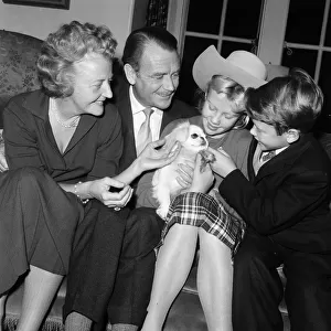Actor John Mills at home with his wife Mary Hayley Bell and two of their children