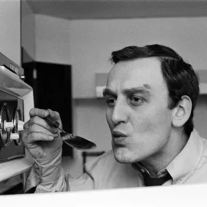 Actor John Thaw has been his own chef for many years. He checks the sauce from one his Actor John Thaw has been his own chef for many years. He checks the sauce from one his