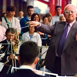 Actor Ken Morley hamming it up with the Eveready Brass Band when he opened by new MFI