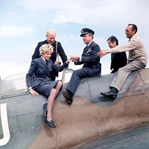 Actor Kenneth More and actress Susannah York seen here sitting on a Spitfire aircraft at