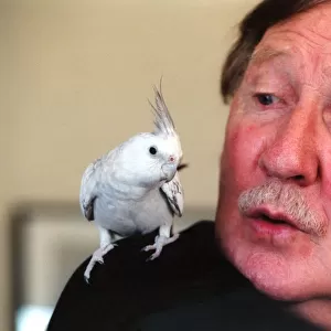 Actor Leslie Phillips with his co star Chazz the cockatiel, at the Theatre Royal