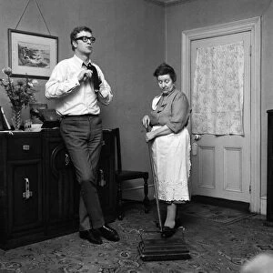 Actor Michael Caine at home with his mother, Ellen. 2nd February 1964