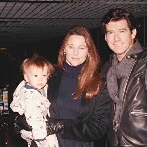 Actor Pierce Brosnan and girlfriend Keeley Shay Smith with baby Dylan Thomas arriving at