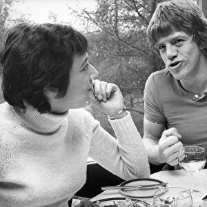 Actor Robin Askwith is interviewed over lunch by reporter Avril Deane while he was