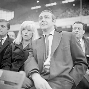 Actor Sean Connery seen here attending a football match with actress Dina Dors