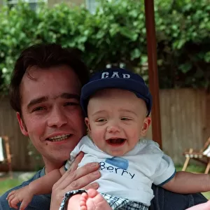 Actor Todd Carty with baby son James at home June 1997