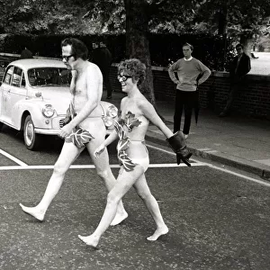 Actors Bill Bailey and Marie Adams crossing Bayswater Road in London naked as they