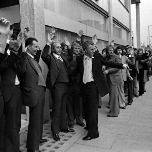 Actors John Thaw and Dennis Waterman frisk 56 men outside the Thames TV building during