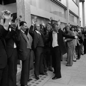 Actors John Thaw and Dennis Waterman frisk 56 men outside the Thames TV building during