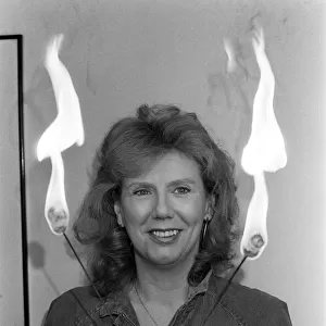 Actress Anna Karen practising her fire-eating act at her home in Ilford, Essex
